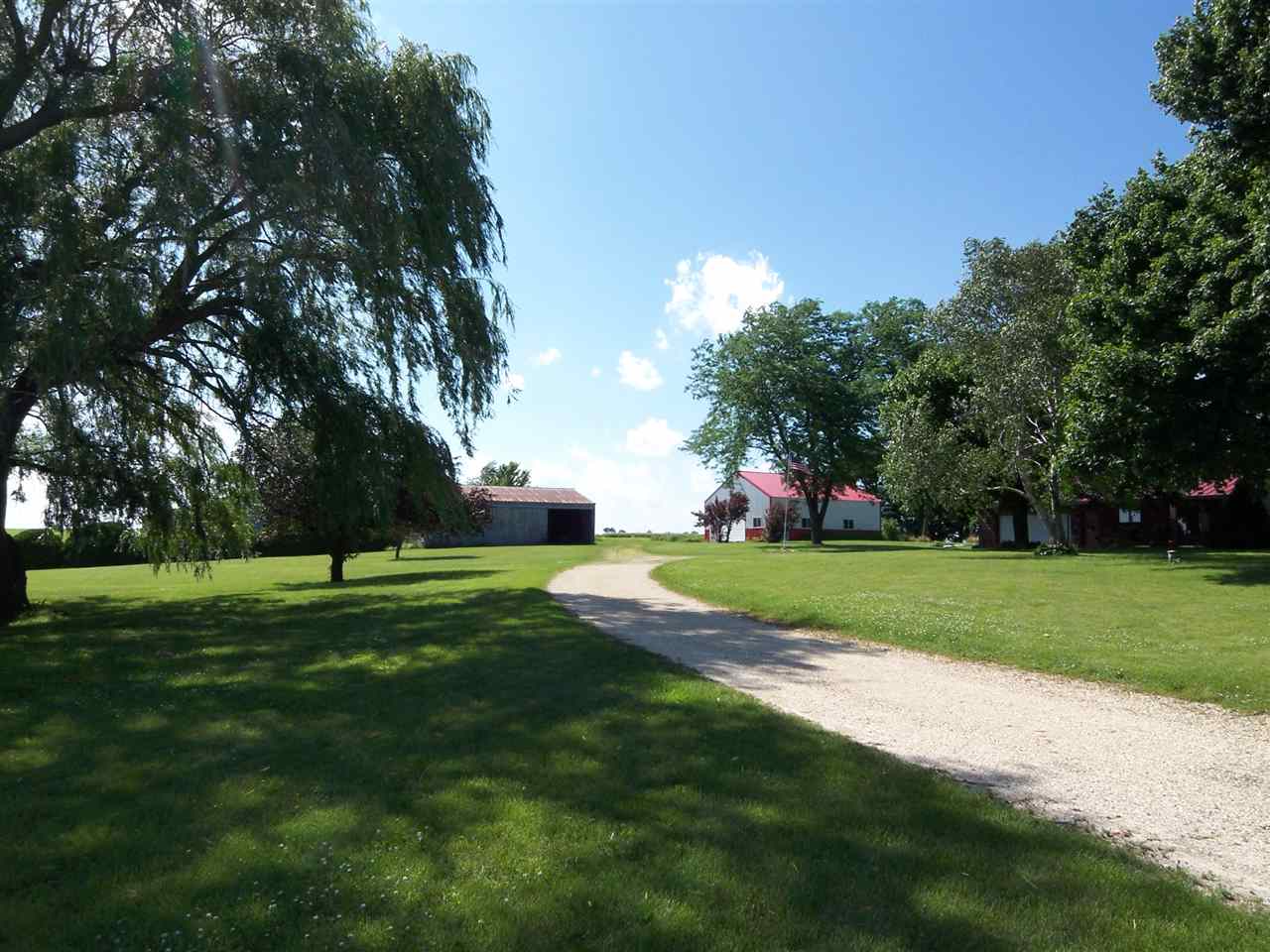 2666 South Rock City Road Ridott, IL 61067 - Photo 20 of 25 a view of a park with large trees