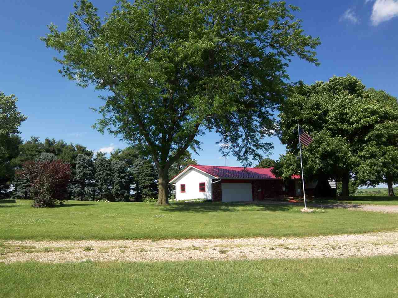 2666 South Rock City Road Ridott, IL 61067 - Photo 21 of 25 a front view of a house with a yard