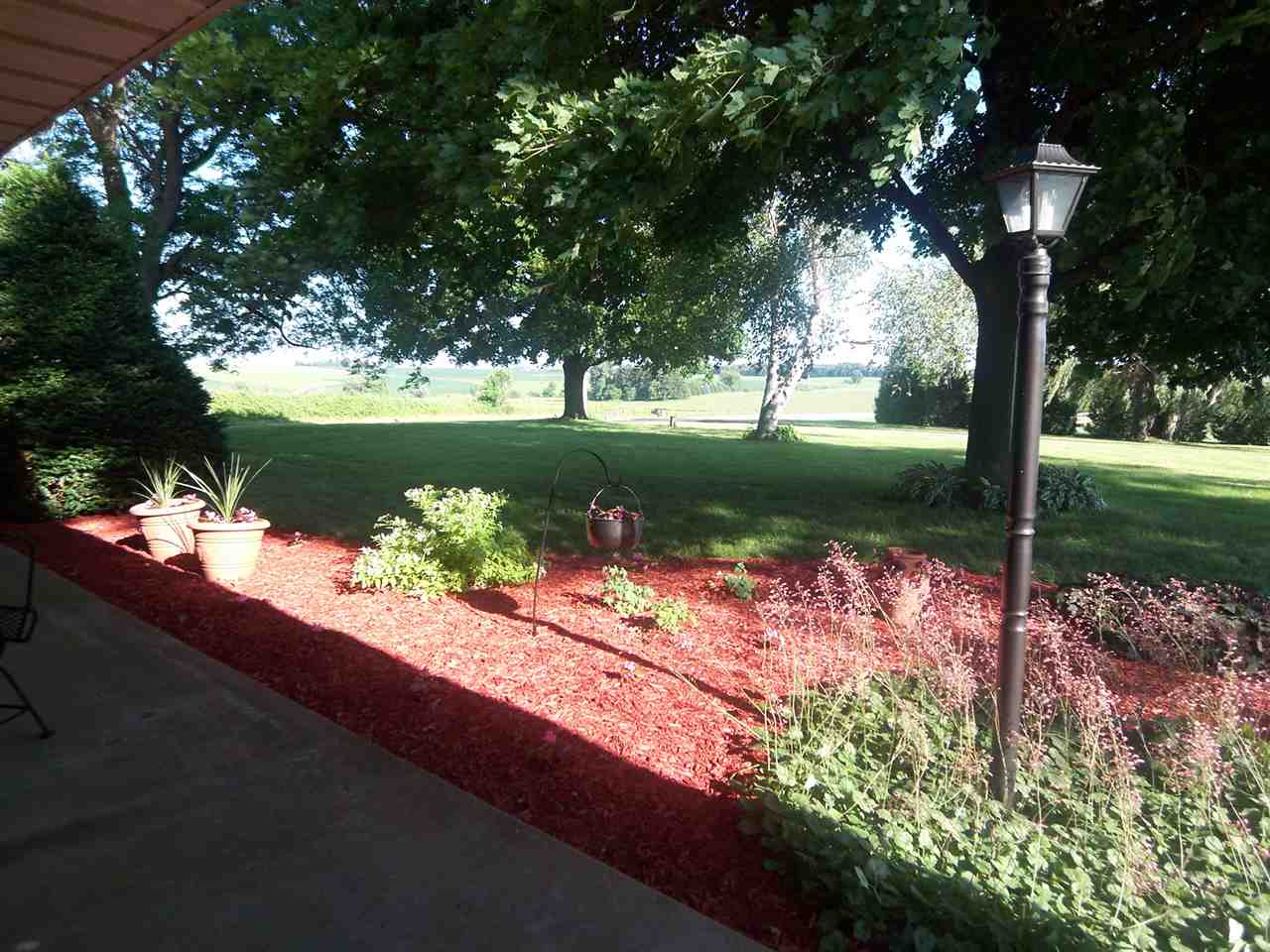 2666 South Rock City Road Ridott, IL 61067 - Photo 3 of 25 a lake view with a fountain back yard