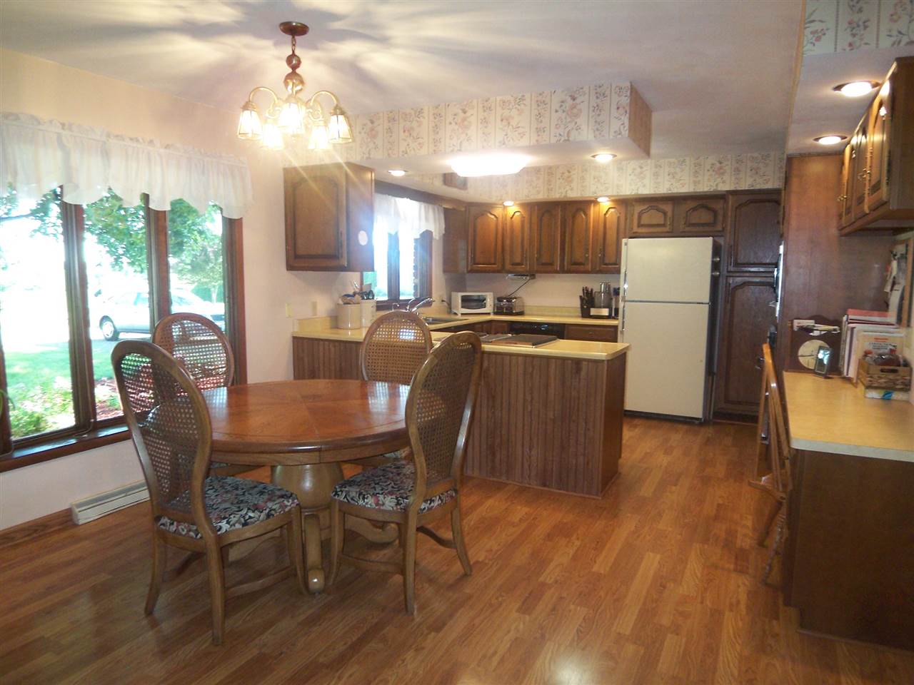 2666 South Rock City Road Ridott, IL 61067 - Photo 6 of 25 a large kitchen with a table and chairs