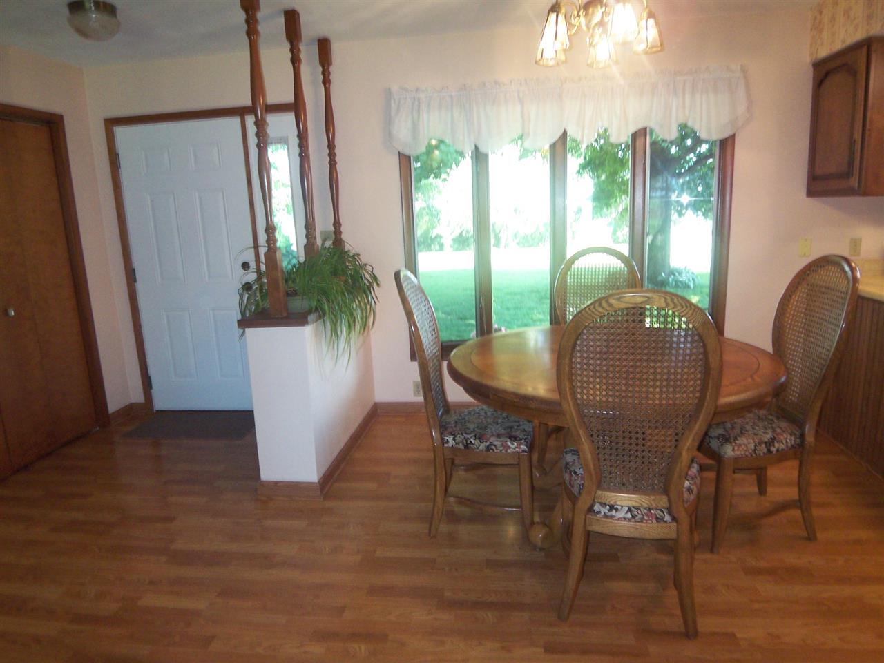 2666 South Rock City Road Ridott, IL 61067 - Photo 9 of 25 a view of a dining room with furniture window and wooden floor