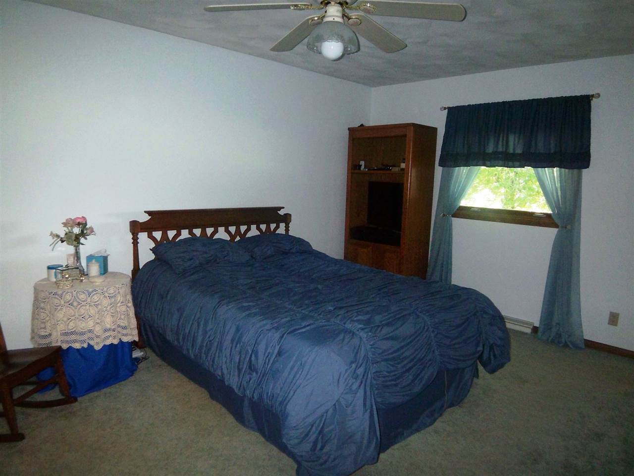 2666 South Rock City Road Ridott, IL 61067 - Photo 10 of 25 a bedroom with a bed and a window