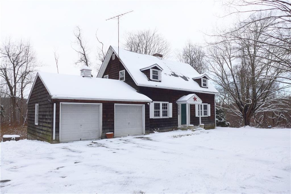 154 Umpawaug Road Redding, CT 06896 - Photo 1 of 1 a front view of a house with a yard covered in snow