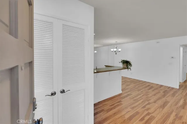 a view of a kitchen with wooden floor