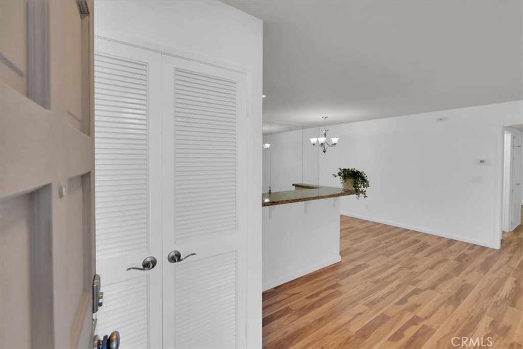 2521 West Sunflower Avenue, Unit H2 Santa Ana, CA 92704 - Photo 2 of 30 a view of a kitchen with wooden floor