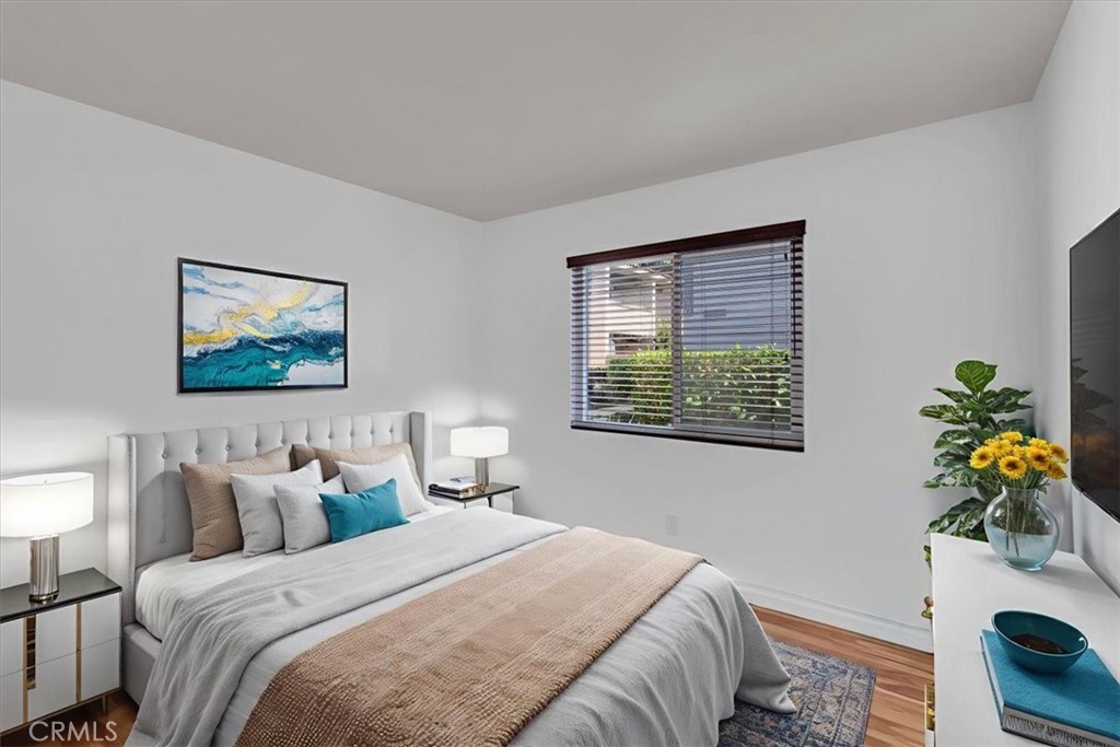 2521 West Sunflower Avenue, Unit H2 Santa Ana, CA 92704 - Photo 29 of 30 a bedroom with bed and window