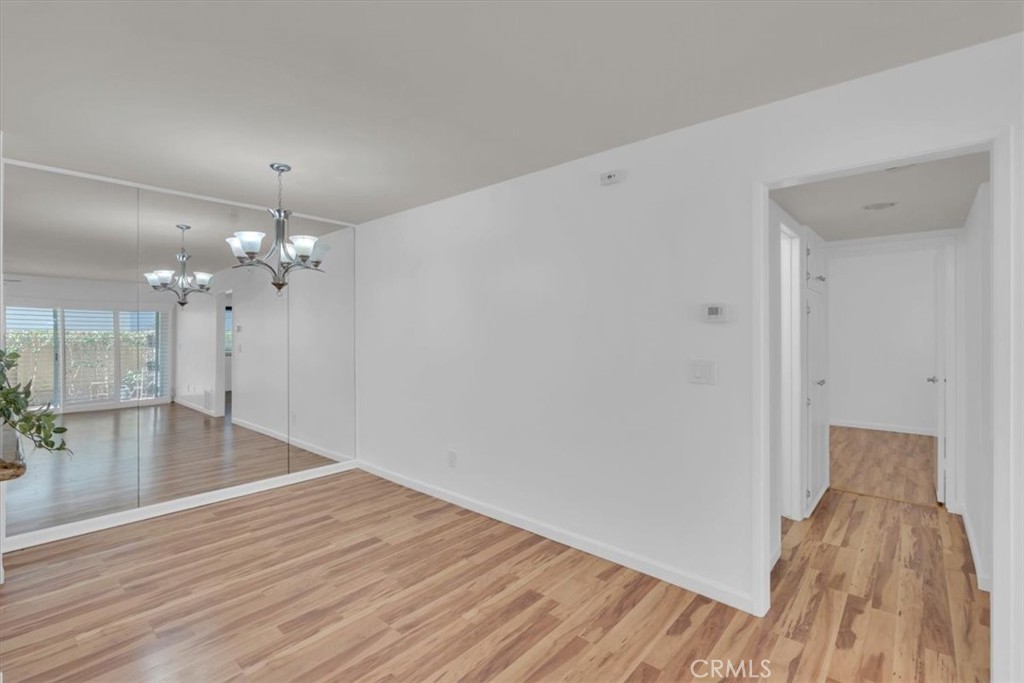 2521 West Sunflower Avenue, Unit H2 Santa Ana, CA 92704 - Photo 5 of 30 a view of a livingroom with wooden floor