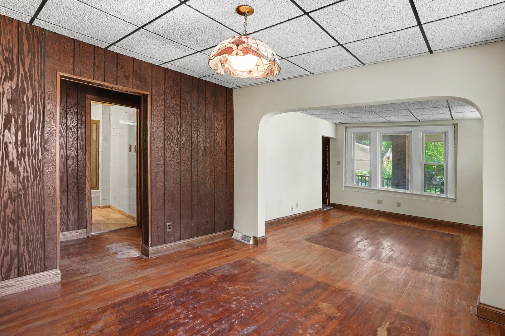1661 Burr Oak Road Homewood, IL 60430 - Photo 3 of 17 an empty room with wooden floor and windows