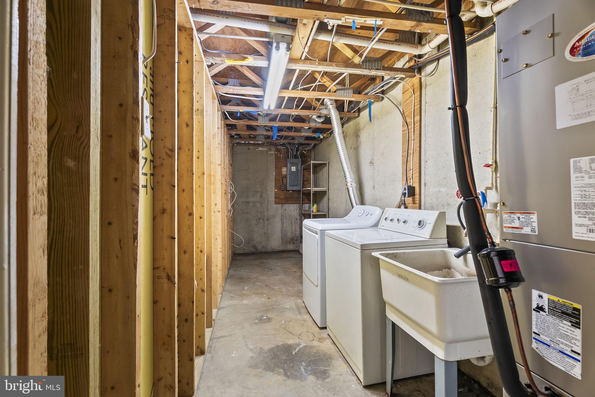 9413 Penshurst Court Gaithersburg, MD 20886 - Photo 26 of 32 a view of a storage & utility room with a sink