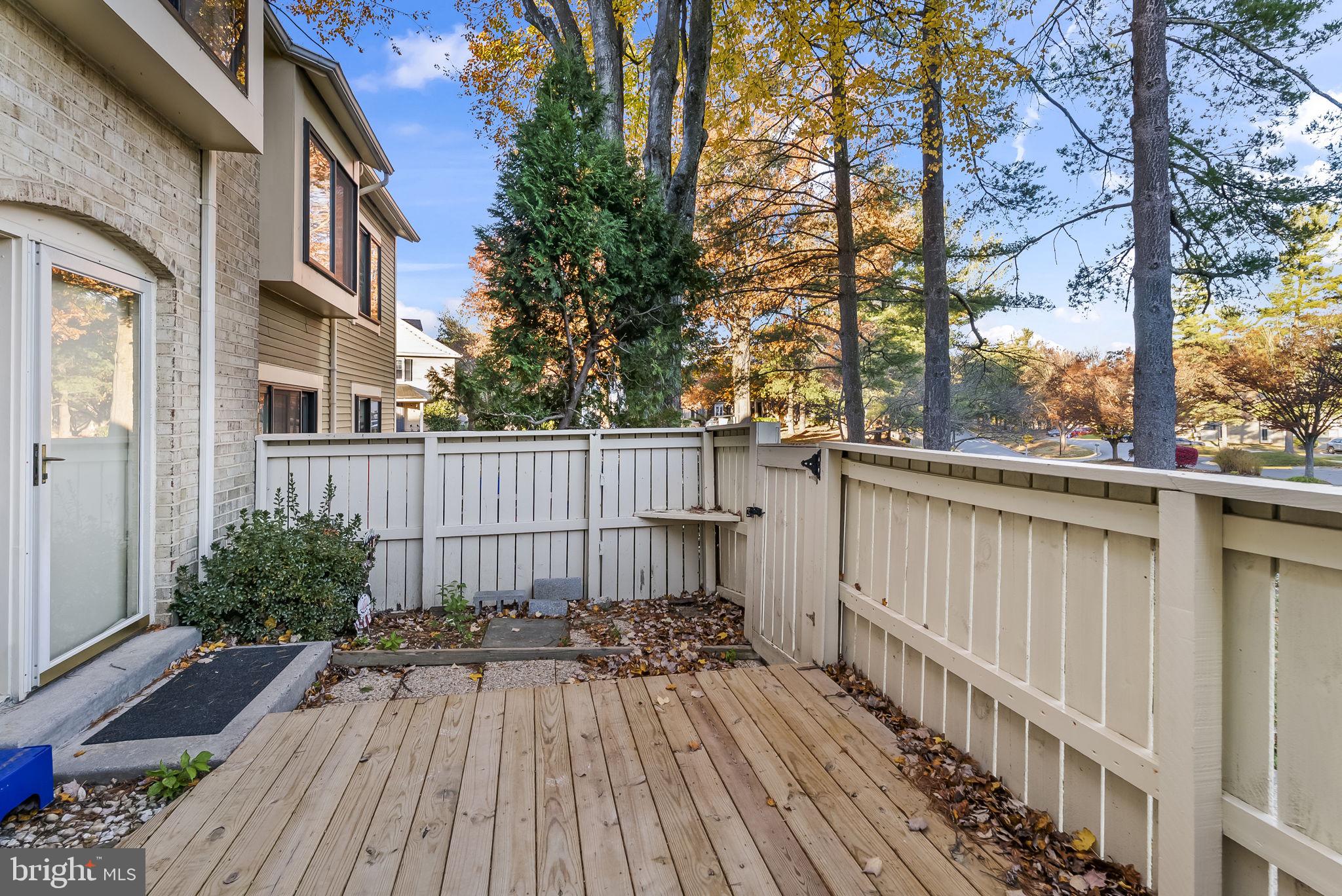 9413 Penshurst Court Gaithersburg, MD 20886 - Photo 5 of 32 a view of a wooden fence on the house
