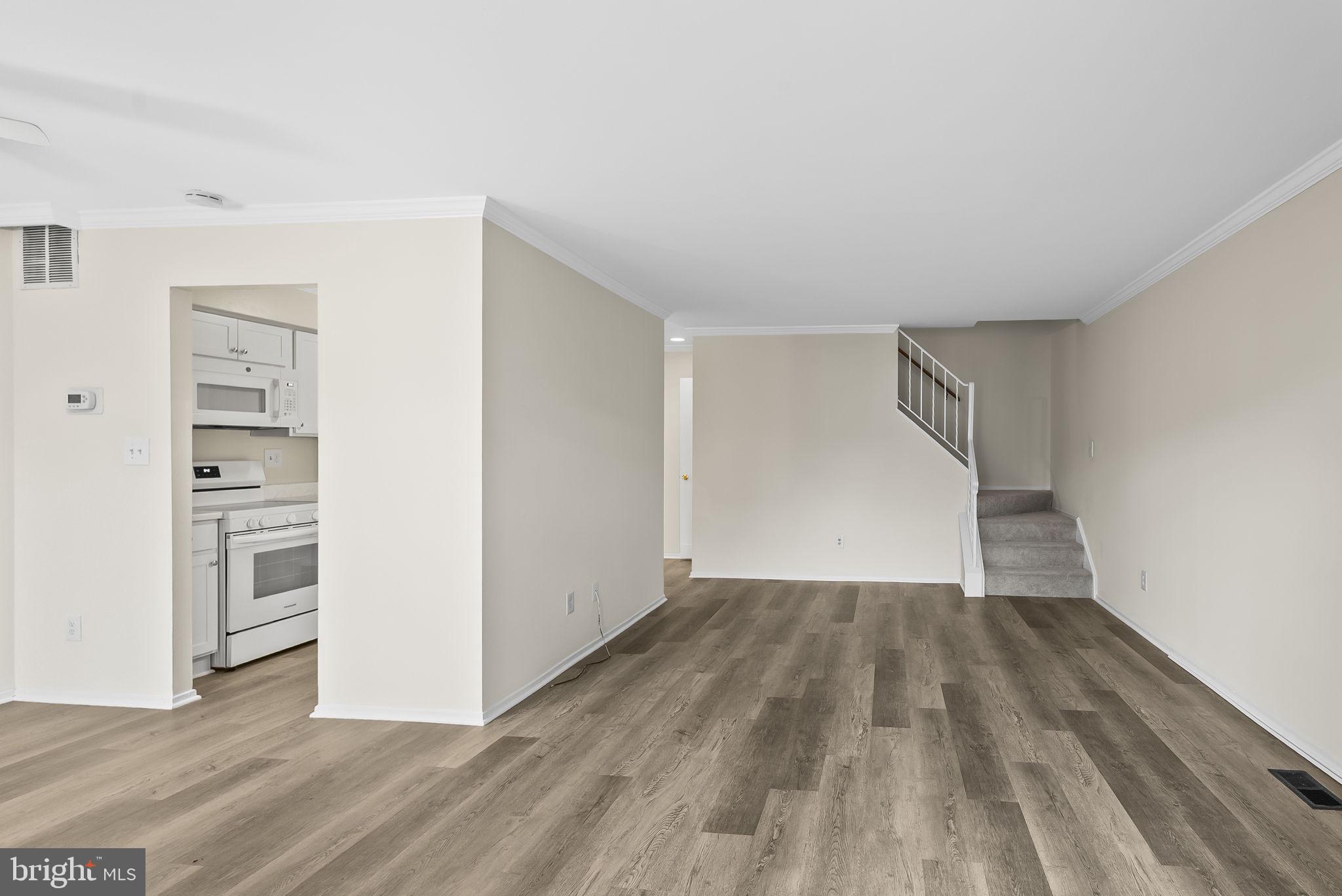 9413 Penshurst Court Gaithersburg, MD 20886 - Photo 7 of 32 wooden floor in an empty room