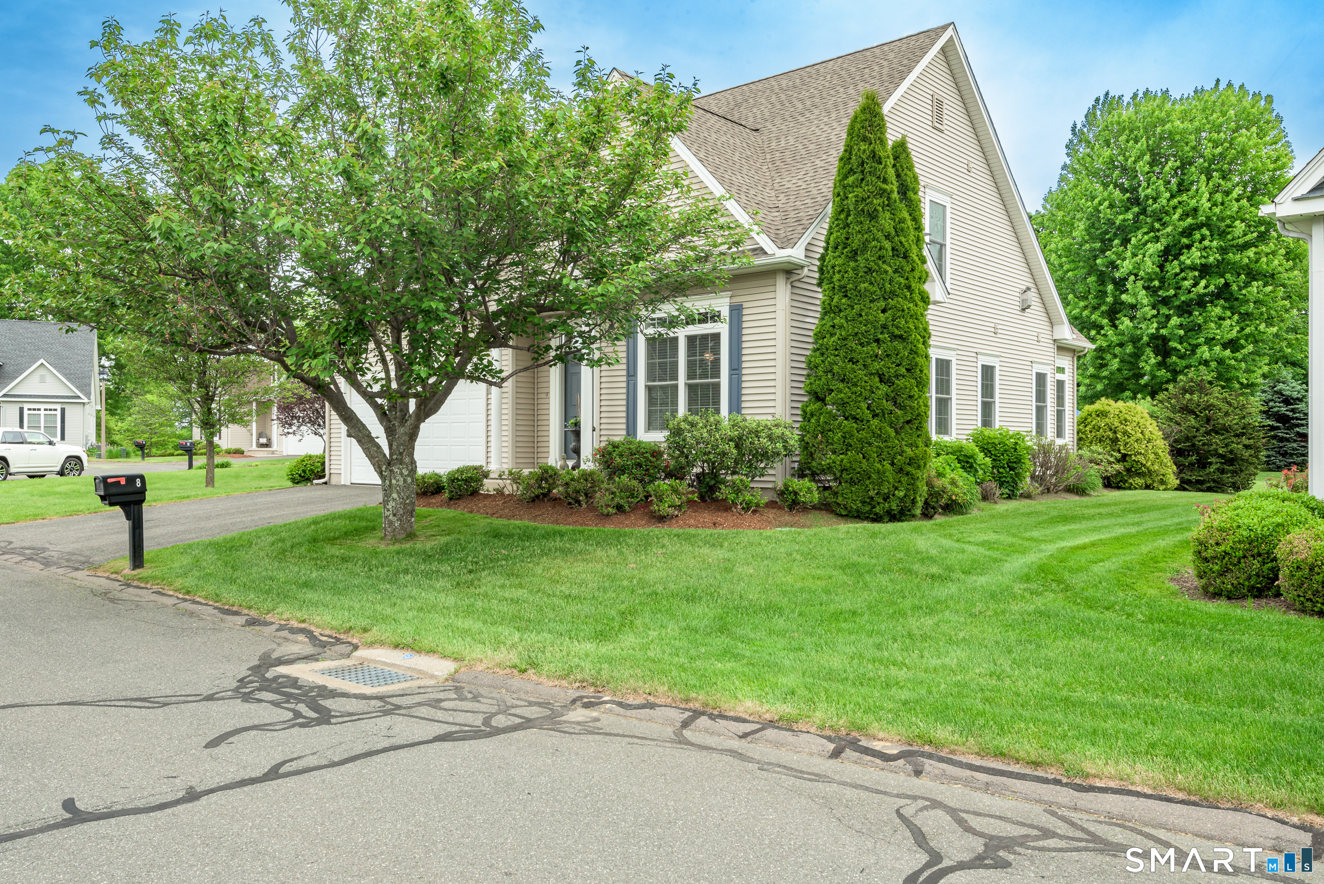 8 Greendale Drive, Unit 8 Suffield, CT 06078 - Photo 3 of 40 front view of a house with a yard