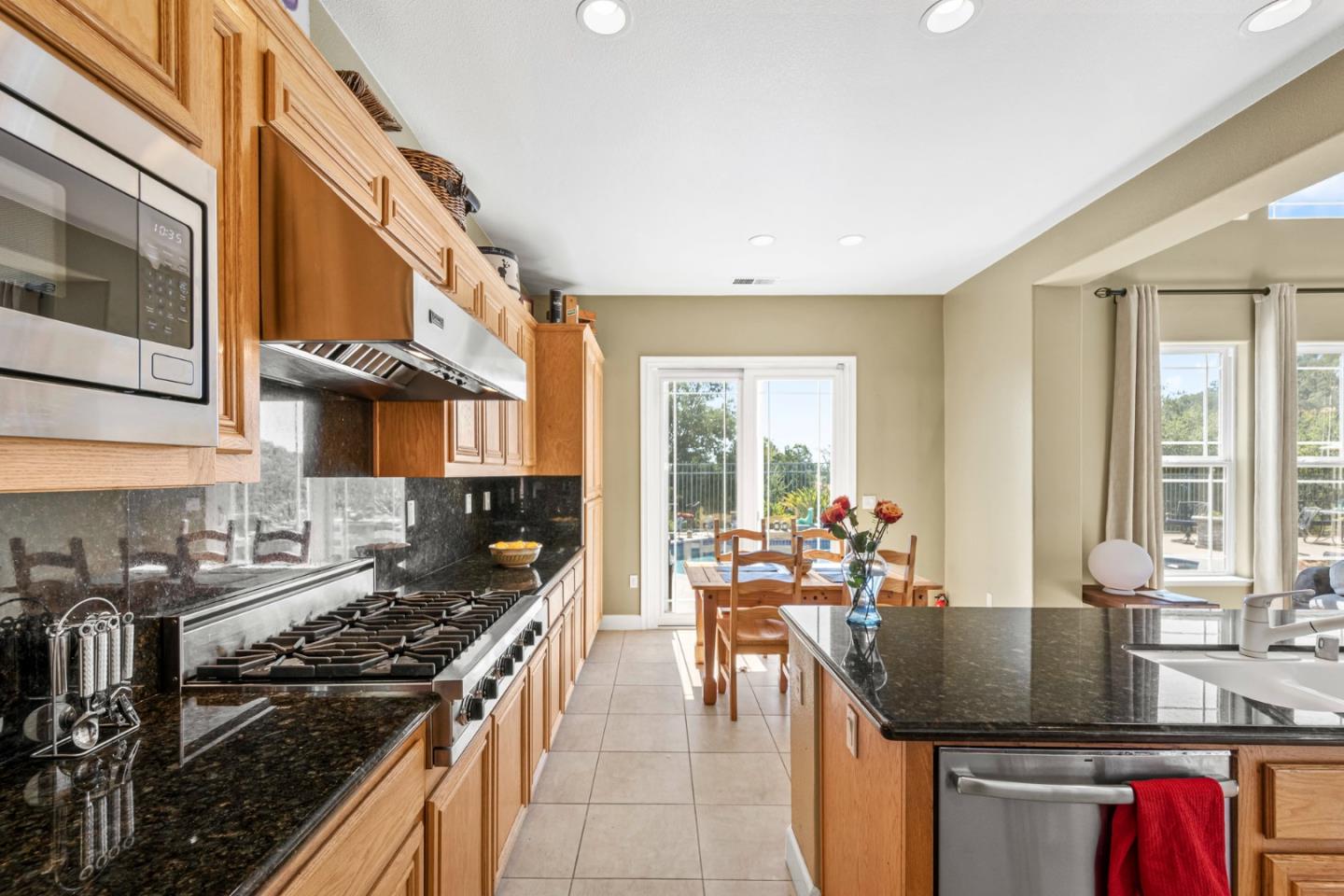 6850 Eagle Ridge Drive Gilroy, CA 95020 - Photo 12 of 51 a kitchen with stainless steel appliances granite countertop a stove and a sink