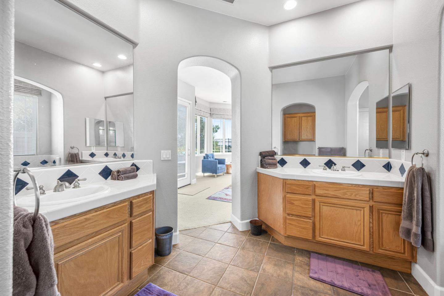 6850 Eagle Ridge Drive Gilroy, CA 95020 - Photo 17 of 51 a spacious bathroom with a double vanity sink mirror and