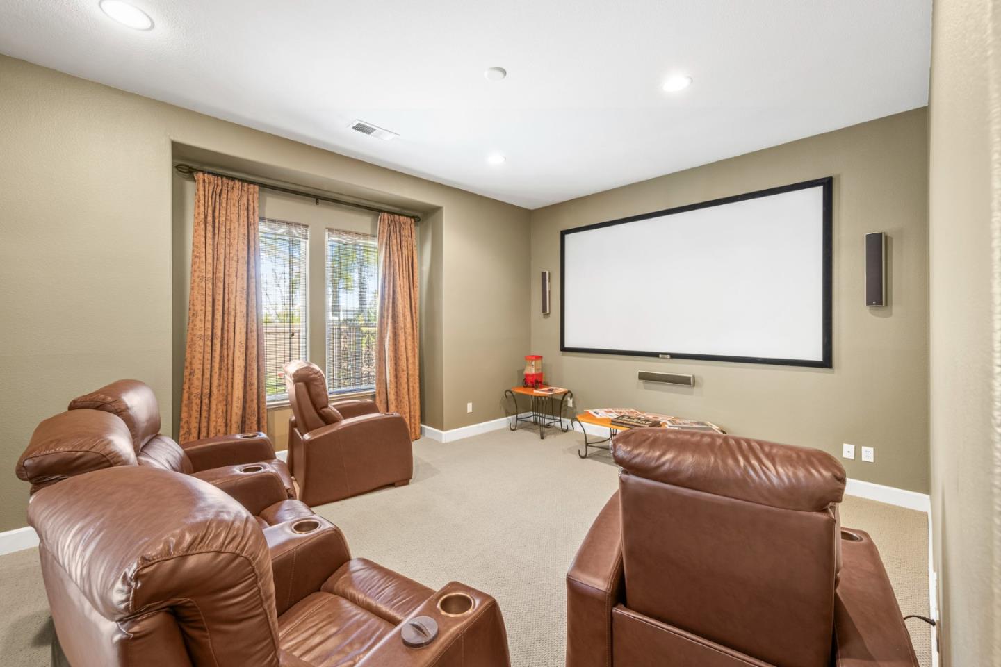 6850 Eagle Ridge Drive Gilroy, CA 95020 - Photo 19 of 51 a living room with furniture two large window and a flat screen tv