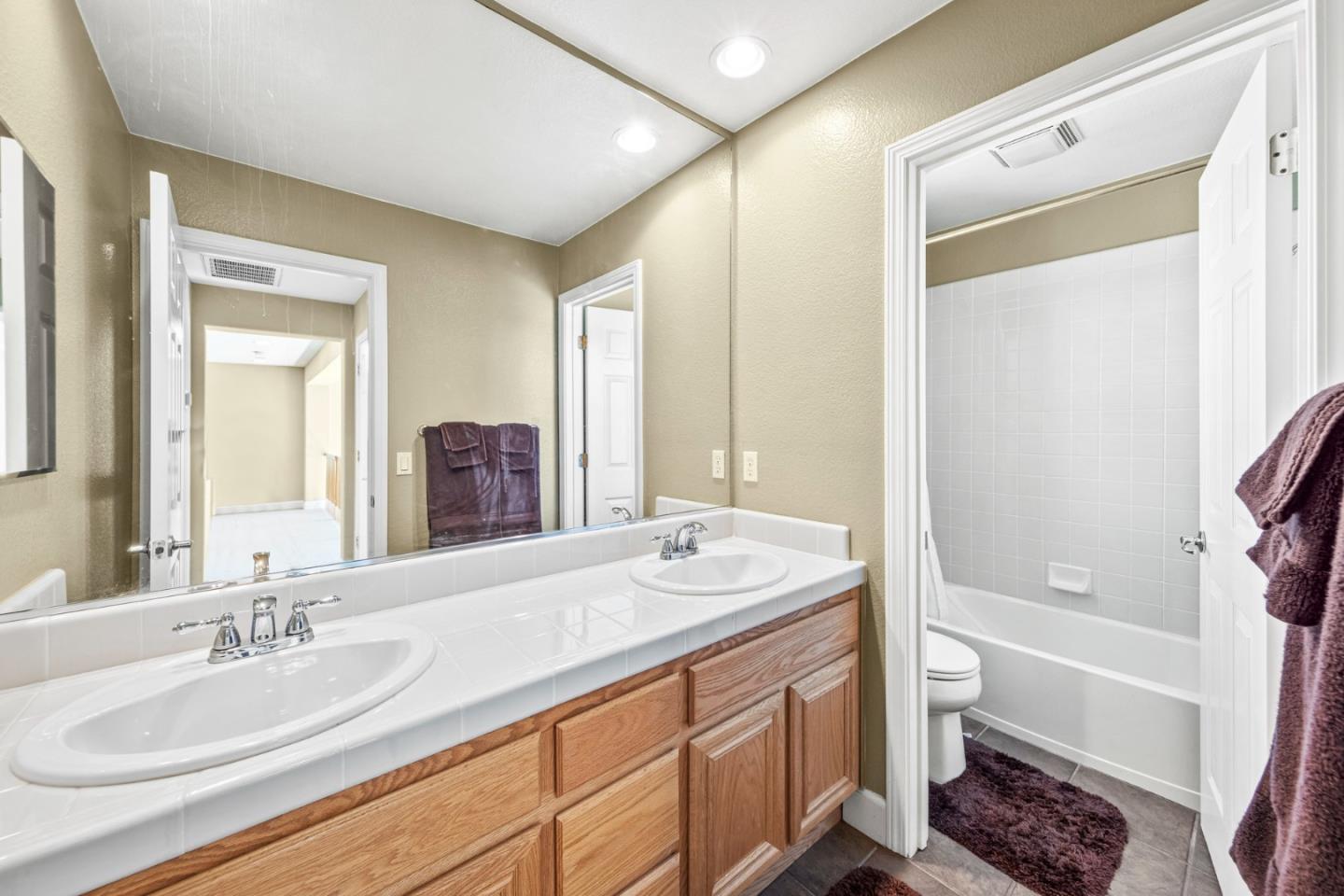 6850 Eagle Ridge Drive Gilroy, CA 95020 - Photo 25 of 51 a bathroom with a granite countertop sink tub double and mirror