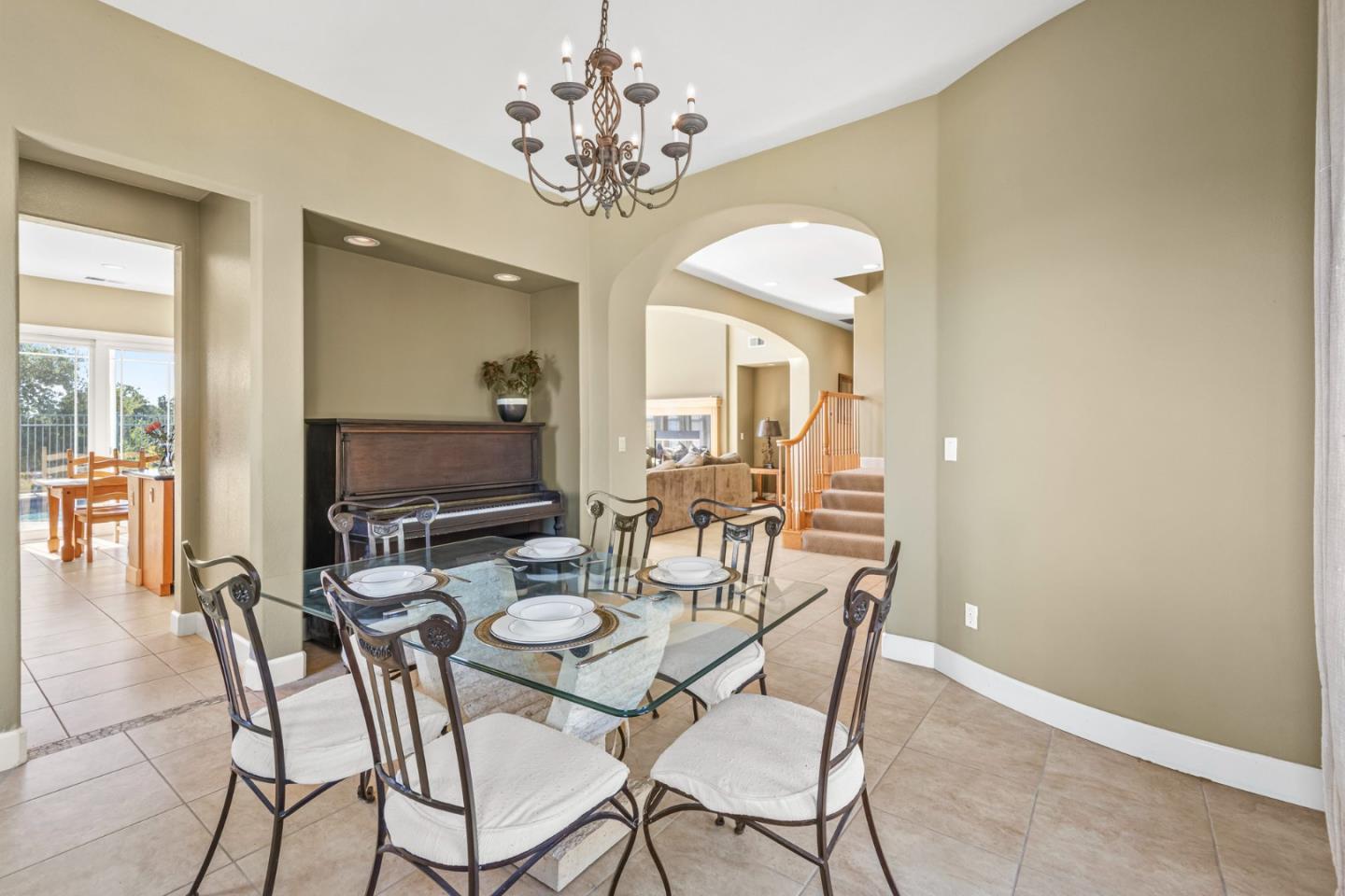 6850 Eagle Ridge Drive Gilroy, CA 95020 - Photo 6 of 51 a view of a dining room with furniture and a chandelier