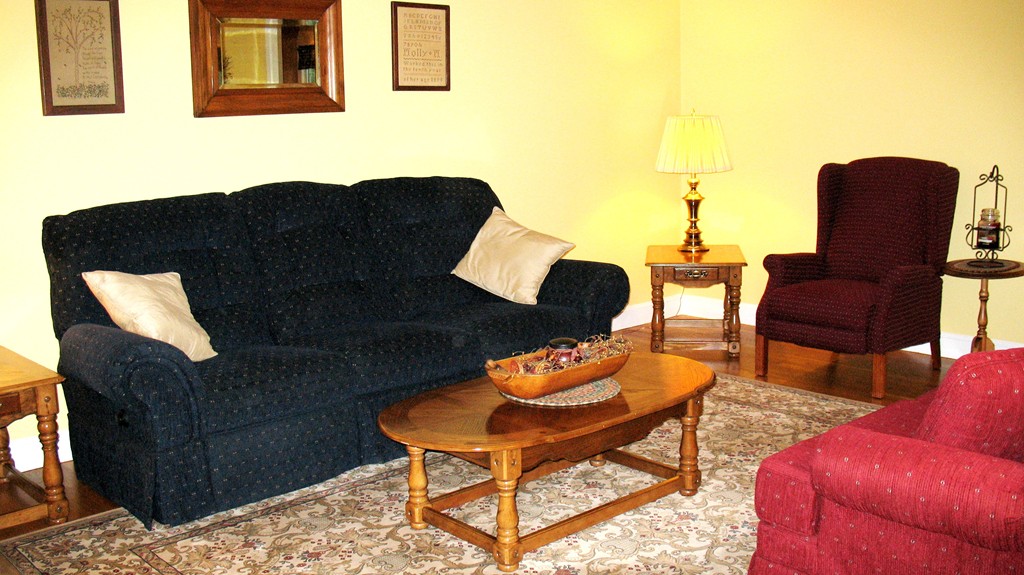 43 Shaker Road Shirley, MA 01464 - Photo 11 of 30 a living room with furniture and a lamp