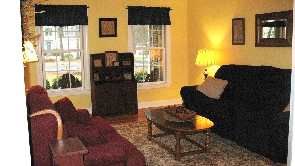 43 Shaker Road Shirley, MA 01464 - Photo 12 of 30 a living room with furniture and a floor to ceiling window