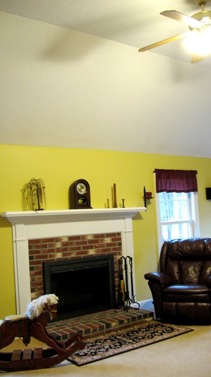 43 Shaker Road Shirley, MA 01464 - Photo 13 of 30 a living room with furniture and a fireplace