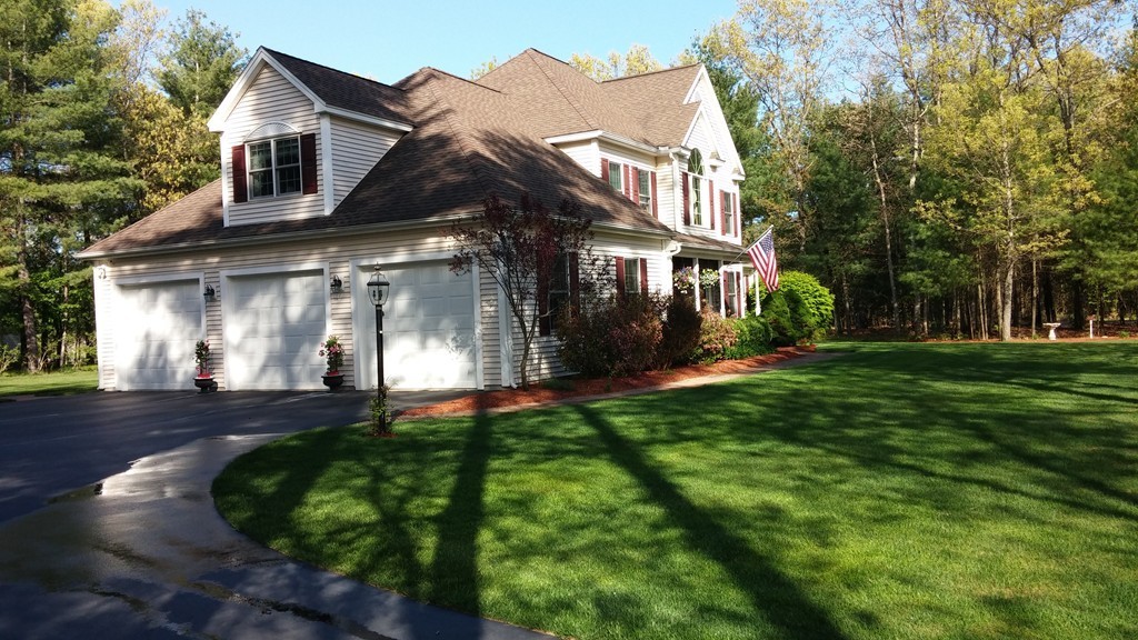 43 Shaker Road Shirley, MA 01464 - Photo 28 of 30 a view of a white house with a big yard and large trees