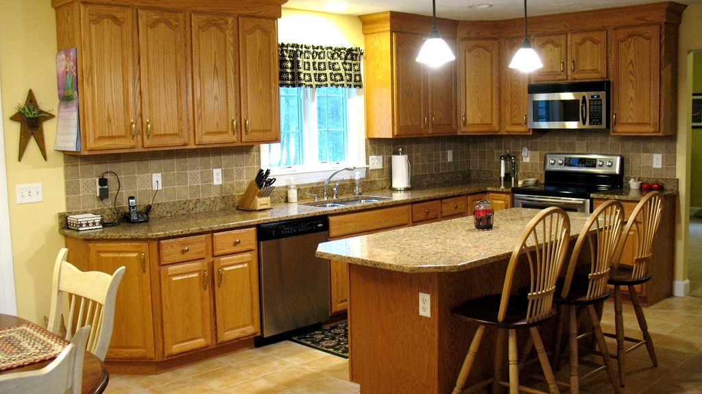 43 Shaker Road Shirley, MA 01464 - Photo 3 of 30 a kitchen with stainless steel appliances granite countertop wooden cabinets a sink and dishwasher