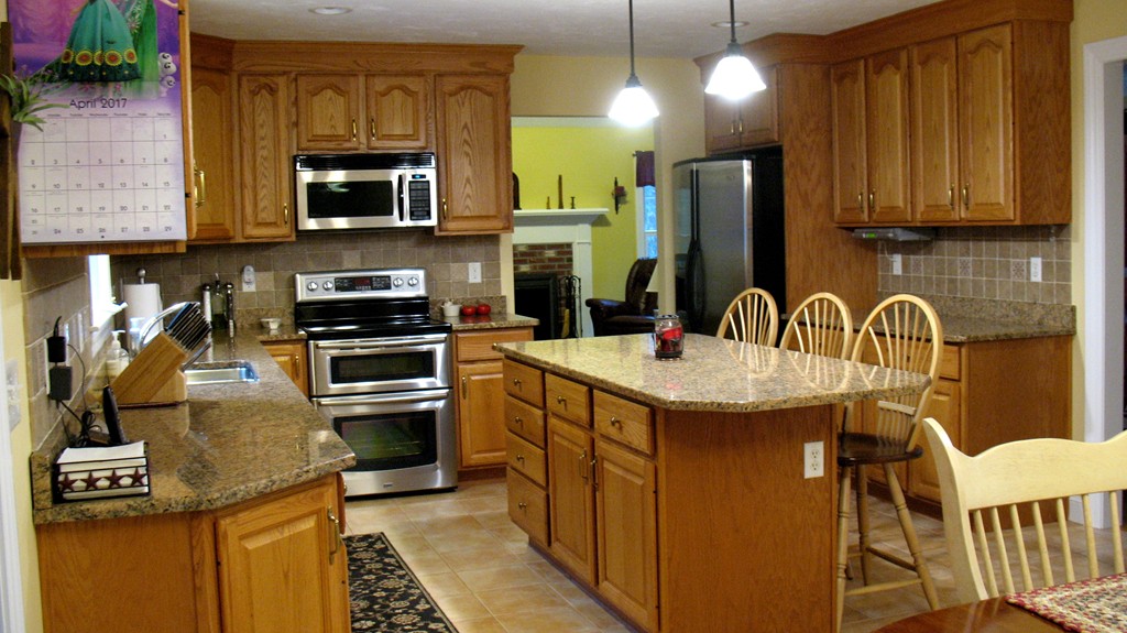 43 Shaker Road Shirley, MA 01464 - Photo 4 of 30 a kitchen with a sink appliances and cabinets