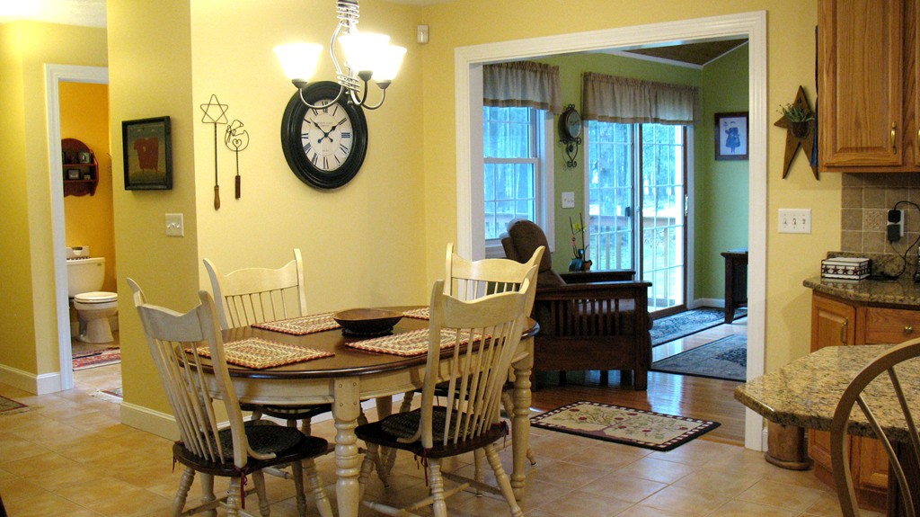 43 Shaker Road Shirley, MA 01464 - Photo 6 of 30 a view of a dining room with furniture kitchen and a chandelier