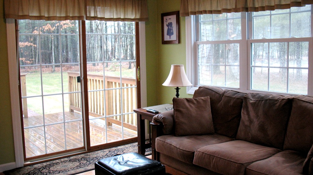 43 Shaker Road Shirley, MA 01464 - Photo 8 of 30 a living room with furniture and a floor to ceiling window