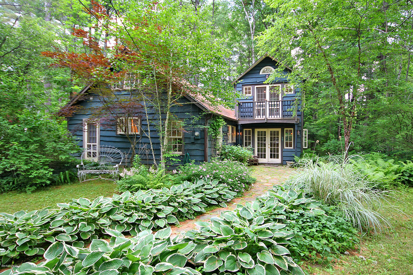 2 Grove Road Stockbridge, MA 01262 - Photo 1 of 25 a front view of a house with a yard