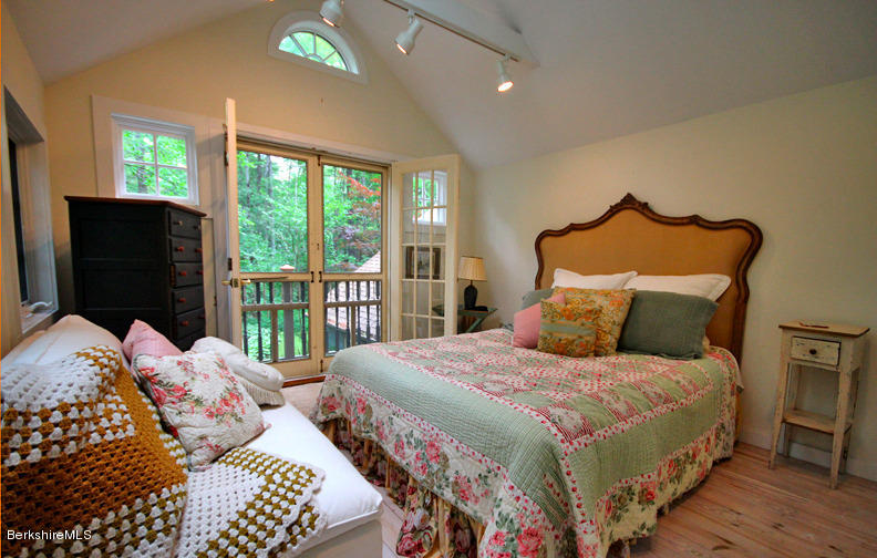 2 Grove Road Stockbridge, MA 01262 - Photo 16 of 25 a bedroom with a bed and glass window