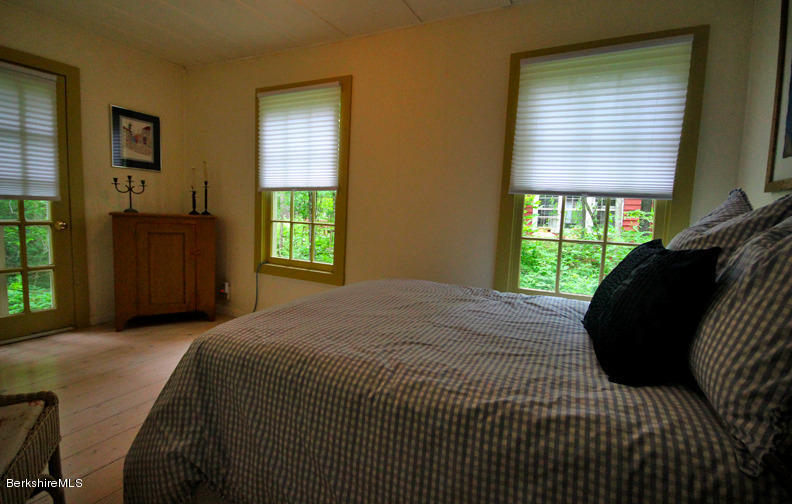 2 Grove Road Stockbridge, MA 01262 - Photo 17 of 25 a bedroom with a bed and a window