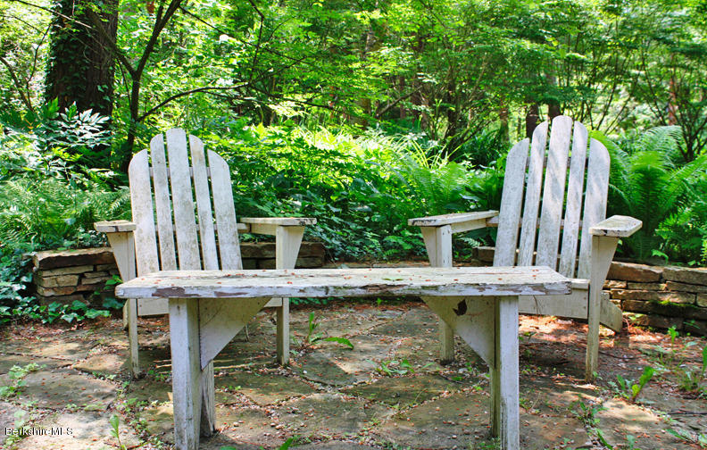 2 Grove Road Stockbridge, MA 01262 - Photo 18 of 25 a view of house with backyard and outdoor seating