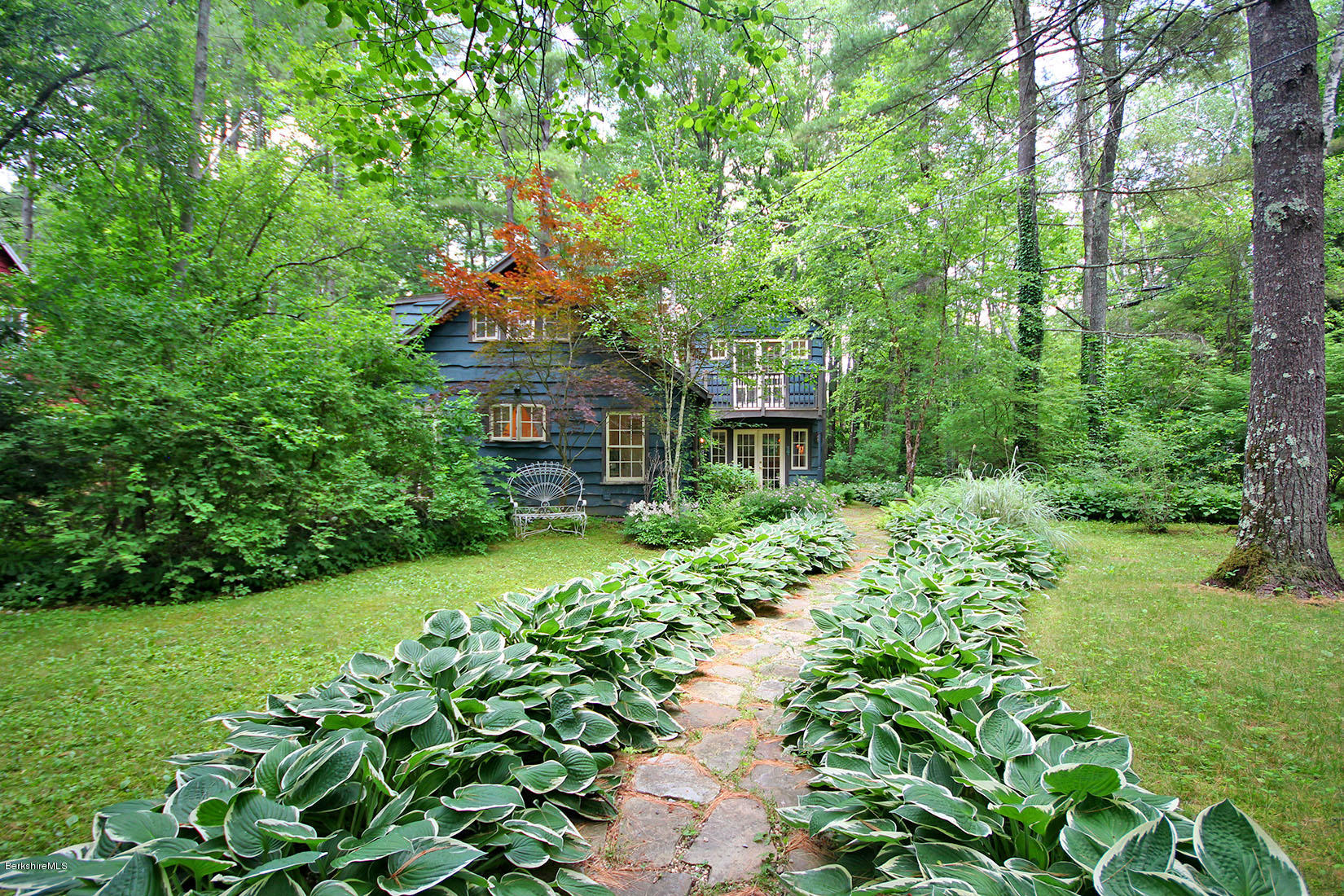 2 Grove Road Stockbridge, MA 01262 - Photo 24 of 25 a front view of a house with a yard