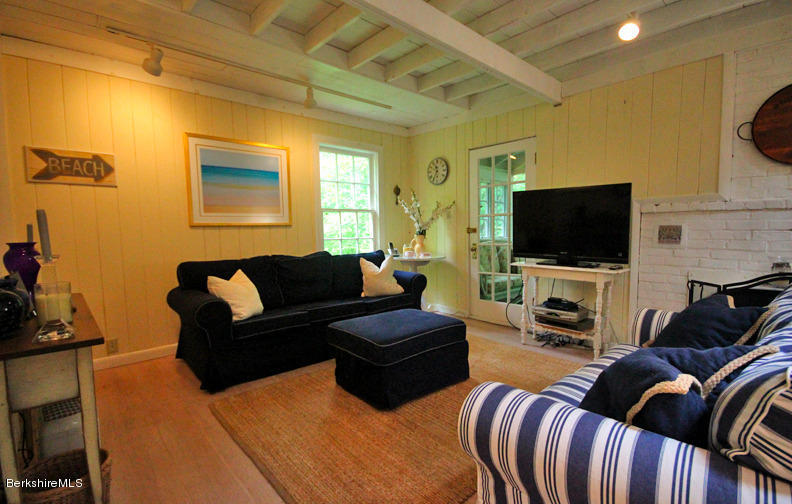 2 Grove Road Stockbridge, MA 01262 - Photo 5 of 25 a living room with furniture and a flat screen tv