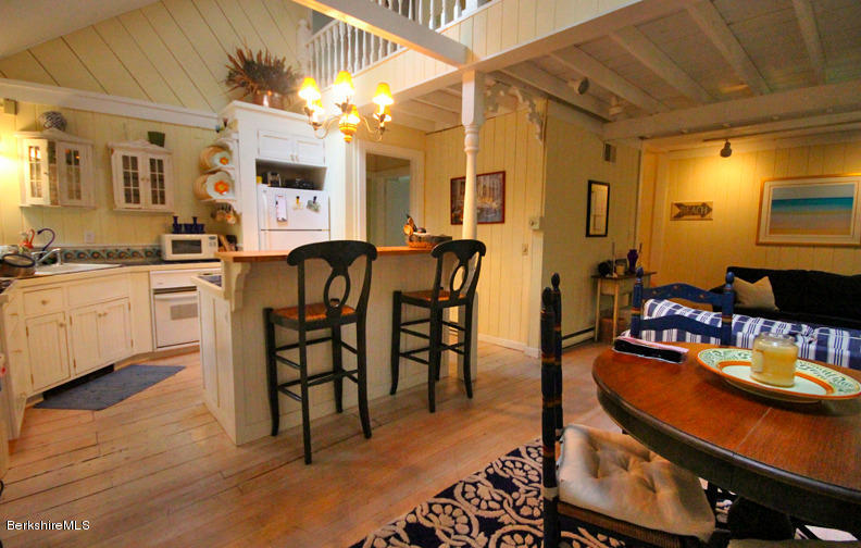 2 Grove Road Stockbridge, MA 01262 - Photo 6 of 25 a kitchen with sink a stove and chairs