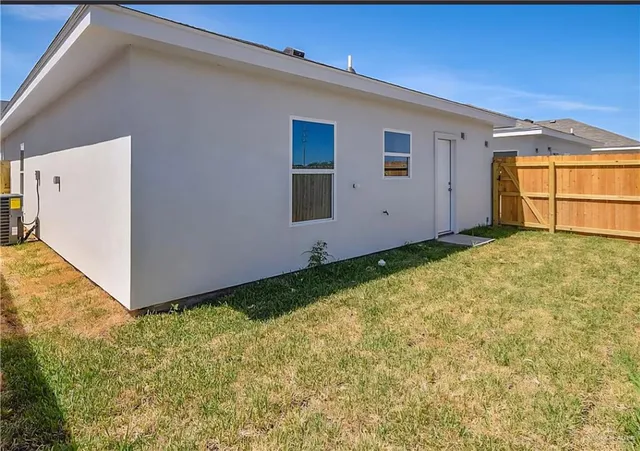 a bathroom with a granite countertop toilet and a sink