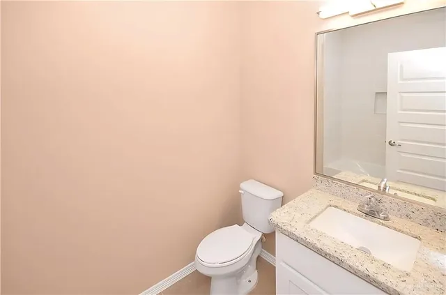 an empty room with closet area