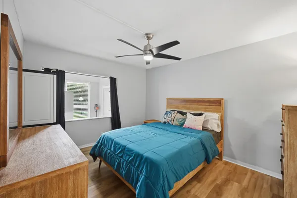 a bedroom with a bed and window