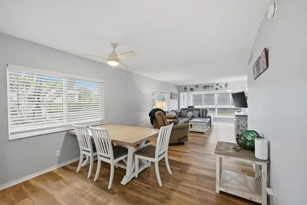 a dining room with furniture and window