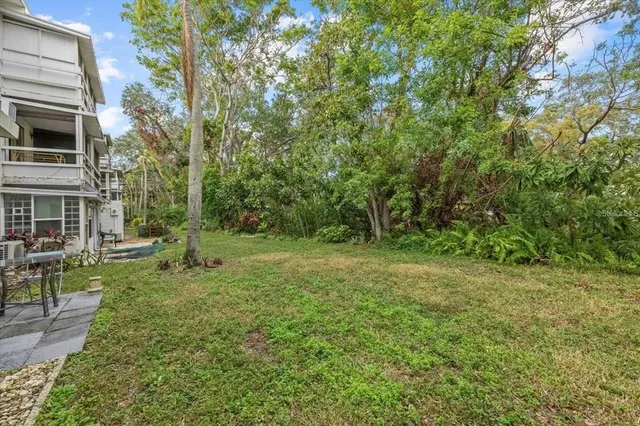 a view of backyard with green space