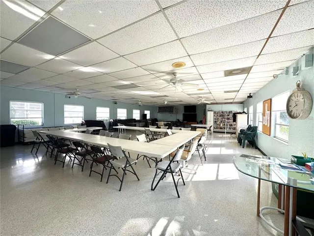 a room with lots of furniture and a chandelier