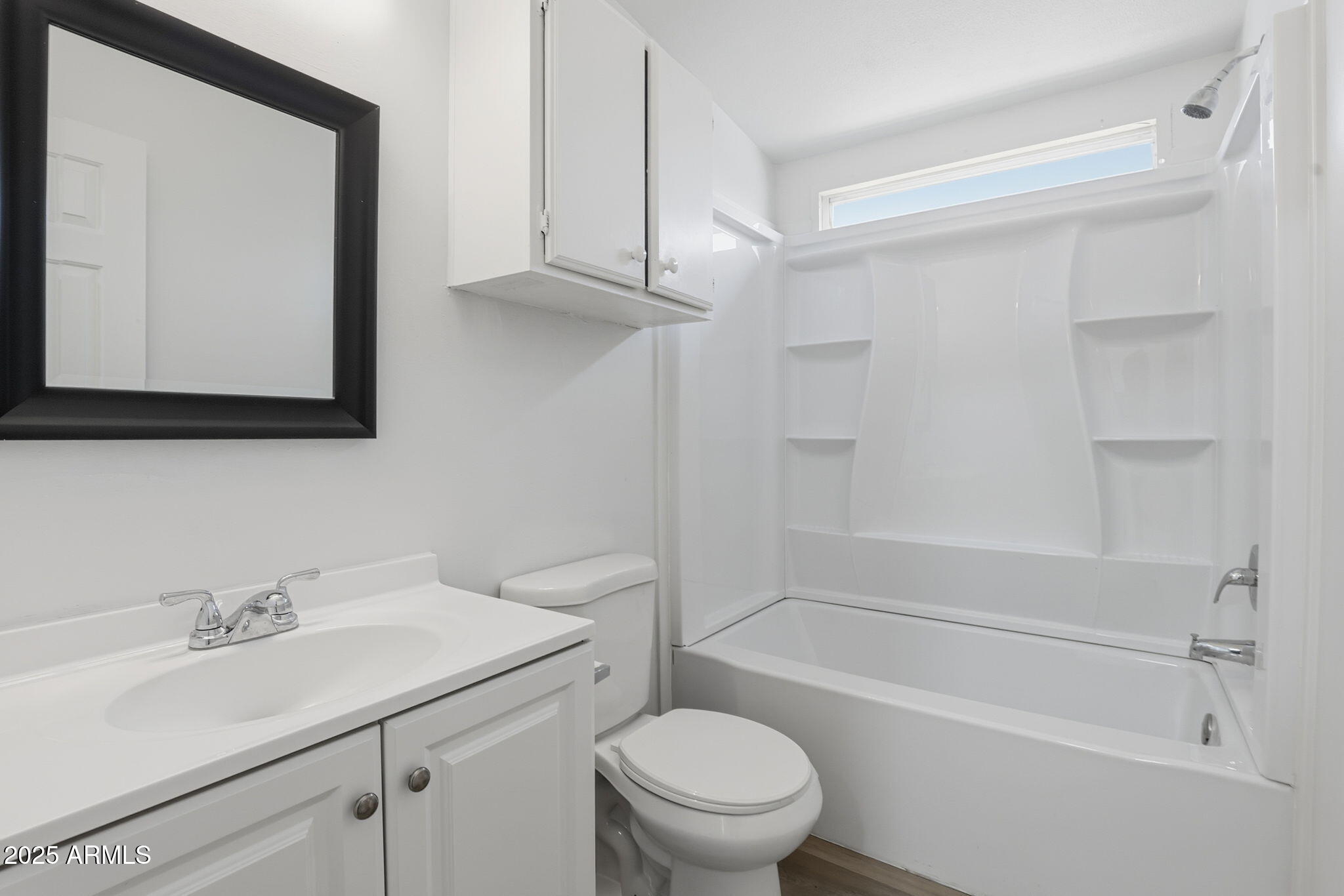 3500 South Tomahawk Road, Unit 142 Apache Junction, AZ 85119 - Photo 22 of 38 a bathroom with a sink a toilet and a bathtub