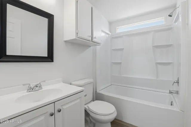a bathroom with a sink a toilet and a bathtub
