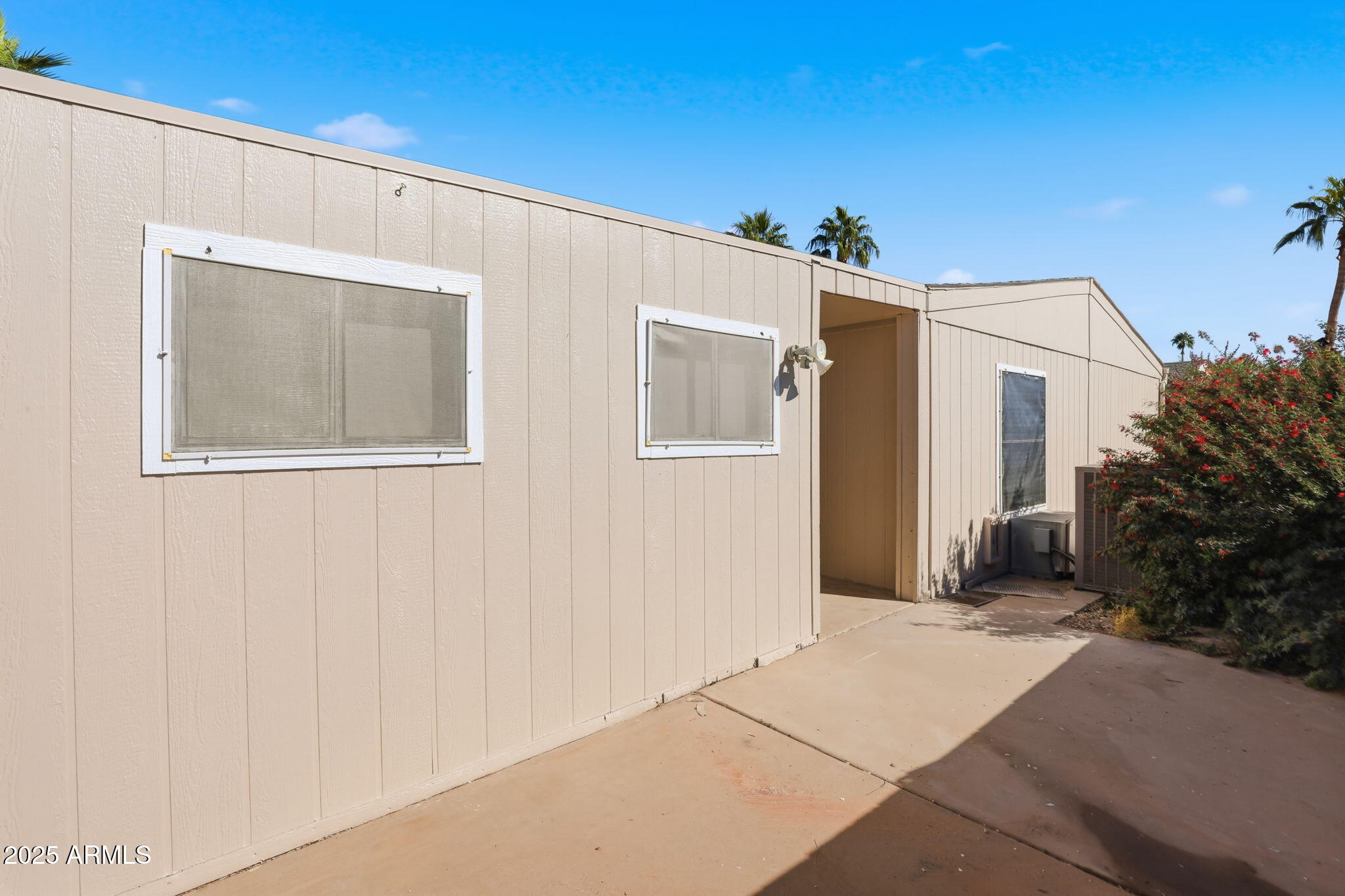 3500 South Tomahawk Road, Unit 142 Apache Junction, AZ 85119 - Photo 26 of 38 a front view of a house with garage