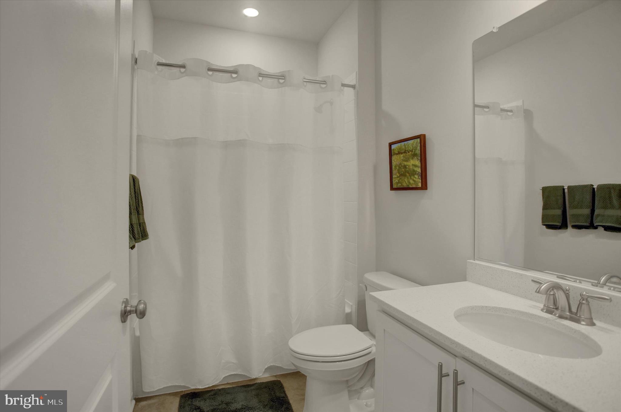 88 Bridge Valley Road Gettysburg, PA 17325 - Photo 12 of 76 a bathroom with a granite countertop sink toilet and a mirror
