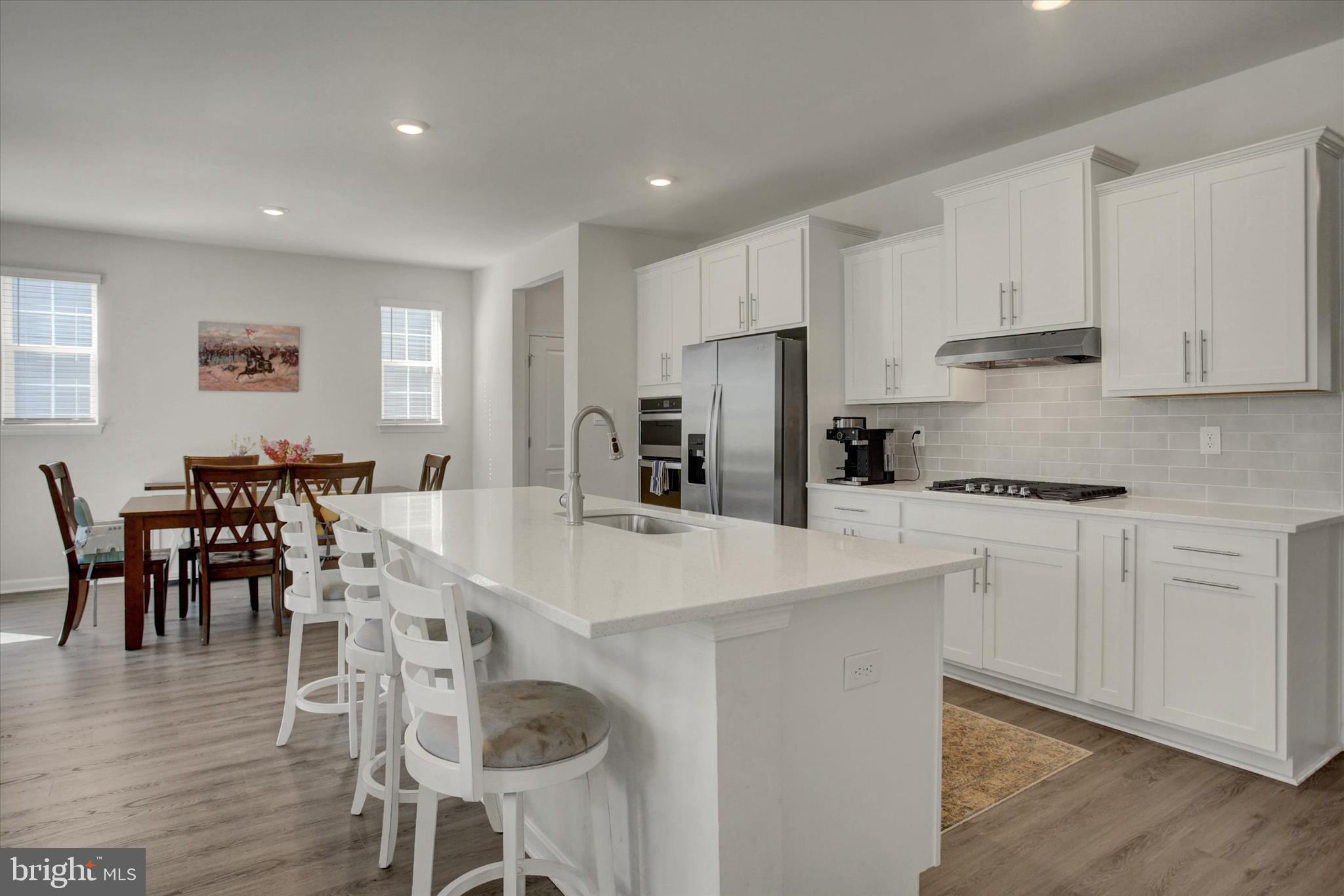 88 Bridge Valley Road Gettysburg, PA 17325 - Photo 17 of 76 a kitchen with stainless steel appliances a table chairs and a refrigerator