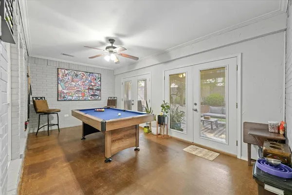 a living room with furniture a table and a chandelier