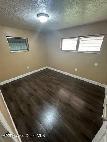 a bathroom with a toilet sink and shower
