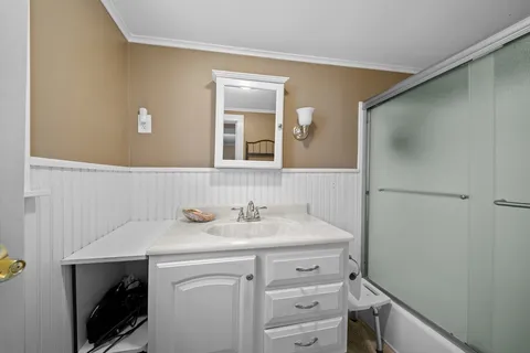 a bathroom with a sink and a mirror
